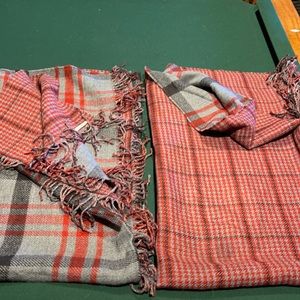 2 Pottery Barn reversible throws with fringe.             gray black red